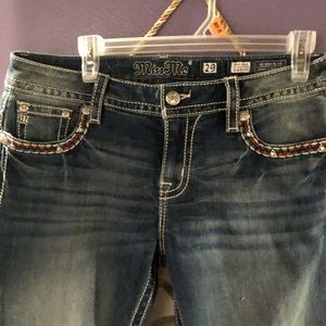 Miss me jeans with red and teal stitching . Size 29.
